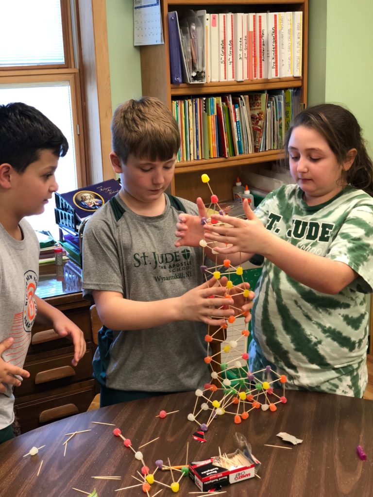 Fourth grader collaboration on building a gumdrop tower